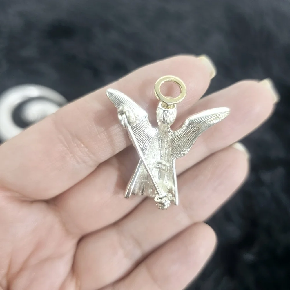 Monet Jewelry two silver-tone brooches
